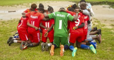"Solidarity" female football team , kneeling for prayers before confronting "Unity" female soccer team in opening match